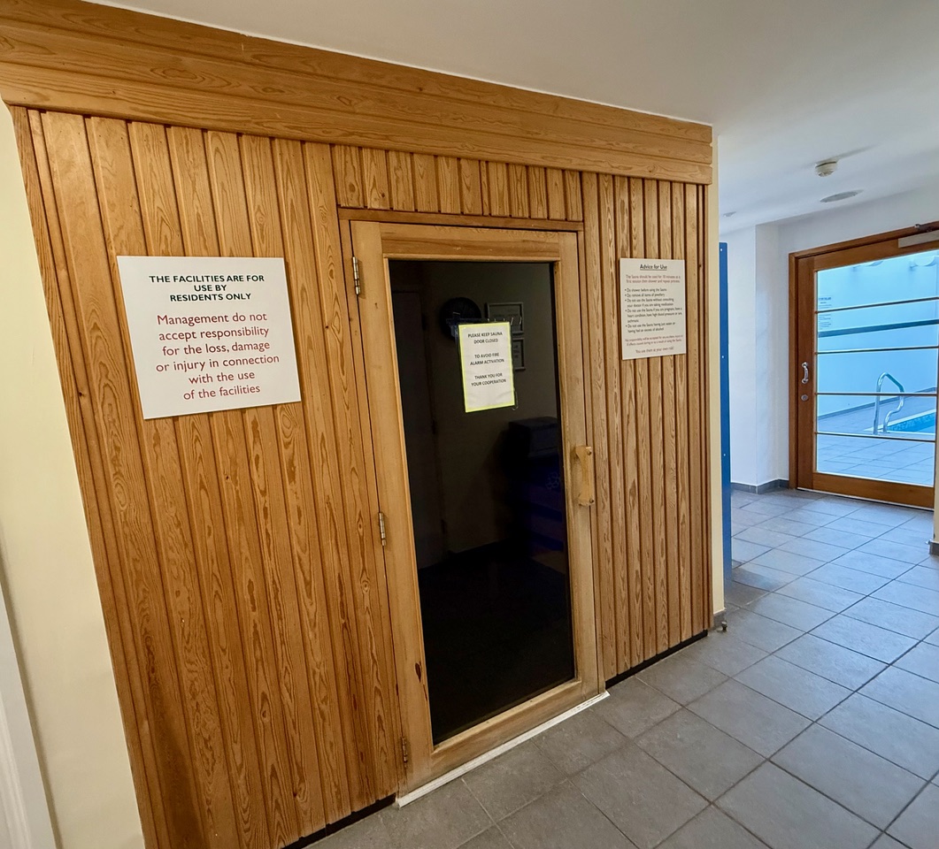 “Private residents’ sauna at Hayes Point with wooden interior and warm ambient lighting.